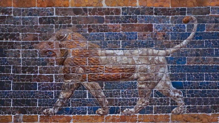 Ancient Lion Relief on a Brick Wall