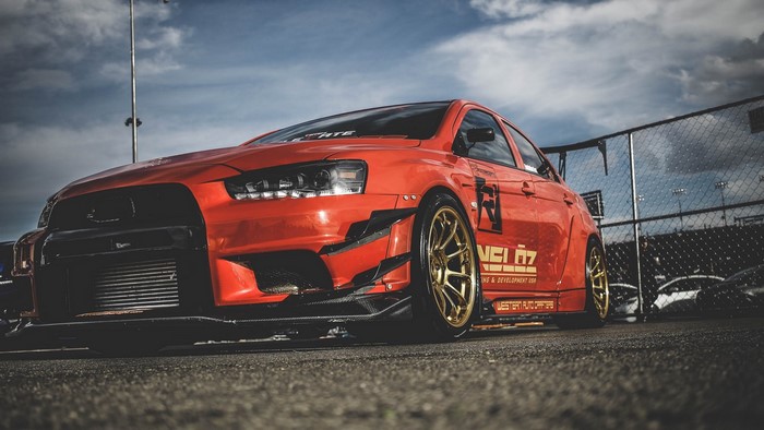 Mitsubishi Lancer Evo X with gold wheels