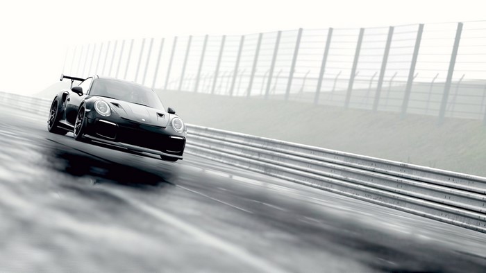 Black Porsche 911 GT2 RS on a wet race track