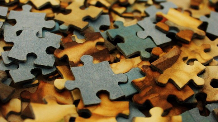 Pile of scattered puzzle pieces