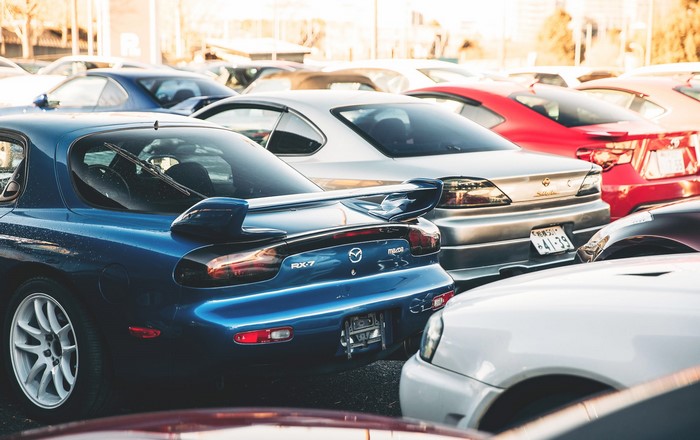 Mazda RX-7 FD and Nissan Silvia S15 cars parked