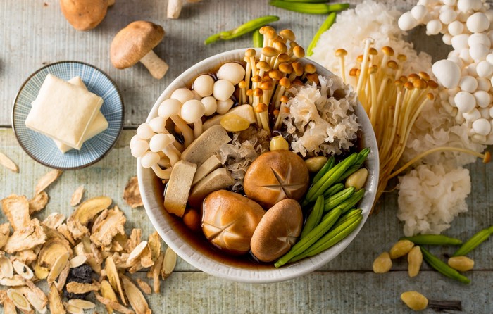 Bowl of mushrooms, tofu, and vegetables