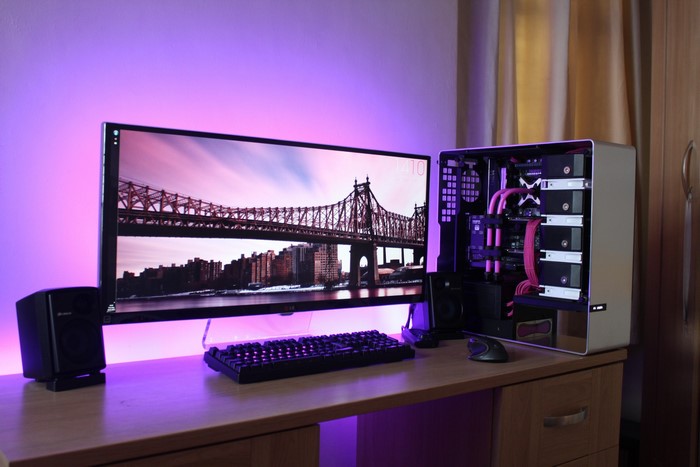 Computer workspace with monitor, keyboard, and PC