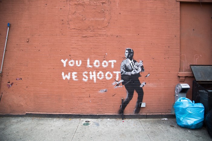 Street art graffiti: You Loot We Shoot