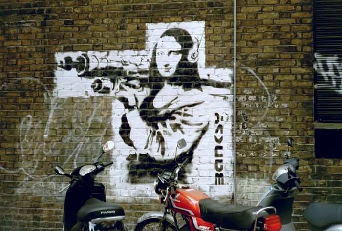 Banksy Mona Lisa with grenade launcher graffiti