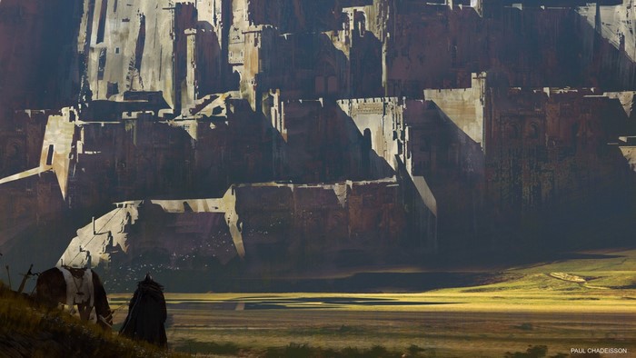 Fantasy adventurers approach a massive stone fortress