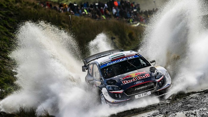 Ford Fiesta WRC car driving through water in Wales