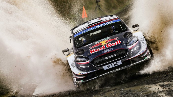 Ford Fiesta rally car driving through water