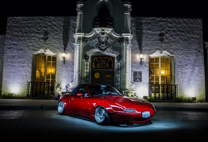 Red widebody Mazda MX-5 with pop-up headlights