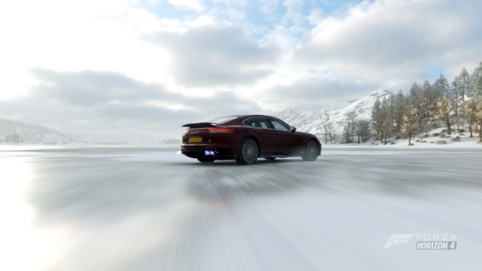 Porsche Panamera driving on a frozen lake in Forza Horizon 4