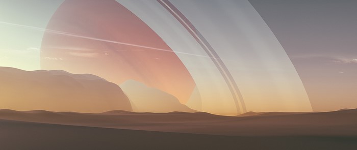Saturn's rings over a desert landscape digital art