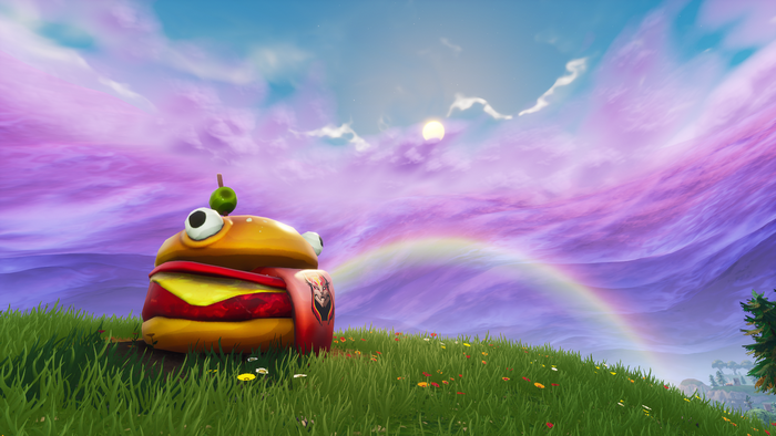 Fortnite Burger character on a grassy hill with rainbow