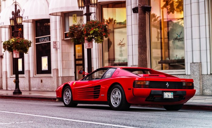 Red Ferrari Testarossa parked on a street