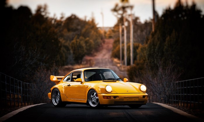 Yellow Porsche 964 on a Bridge