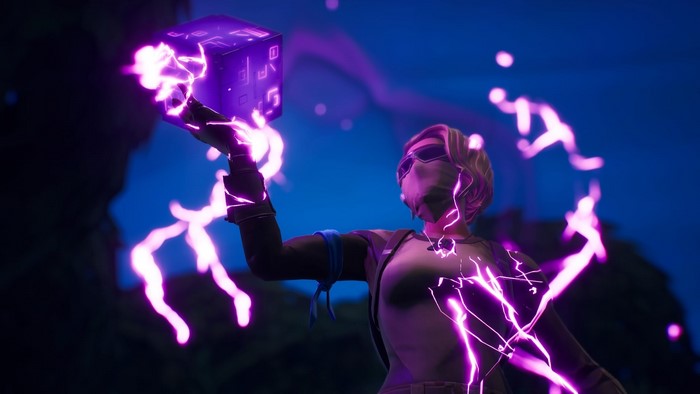 Fortnite character holding a purple cube with lightning