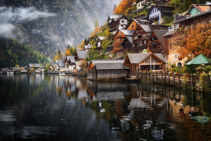 Hallstatt village on a mountainside reflected in a lake