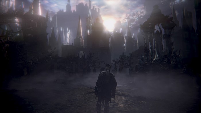 Character in Bloodborne facing a gothic city
