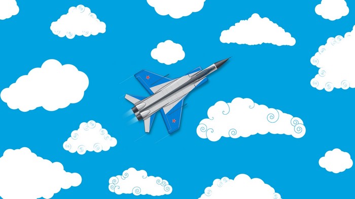 Military jet flying through clouds