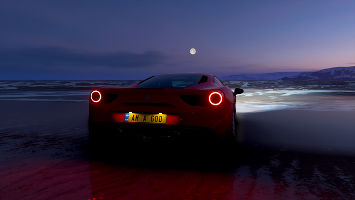 Red Ferrari 458 on a beach at night
