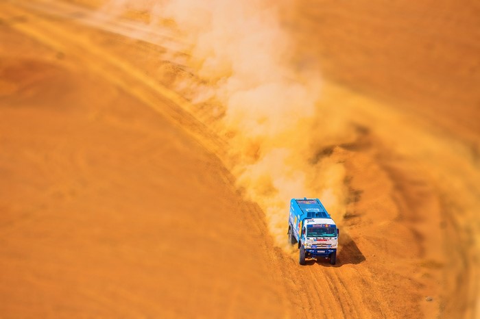 Kamaz truck racing offroad in the desert