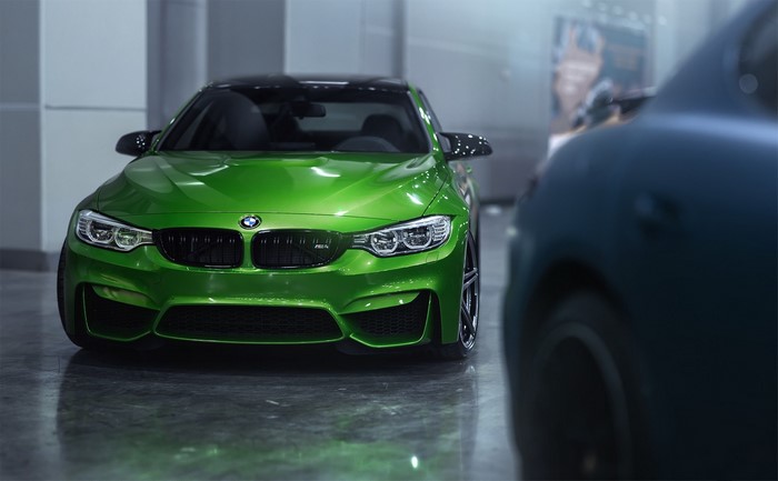 Green BMW M4 F82 parked indoors