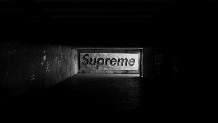 Supreme logo in a dark tunnel