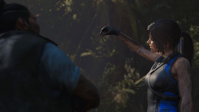 Lara Croft from Shadow of the Tomb Raider holding a necklace