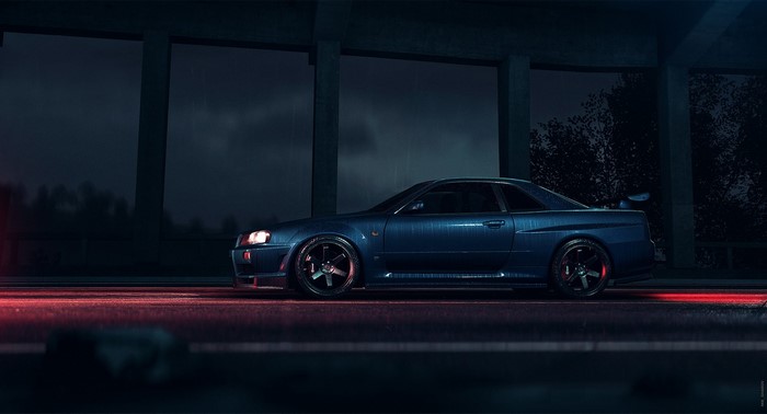 Blue Nissan Skyline GT-R R34 parked at night