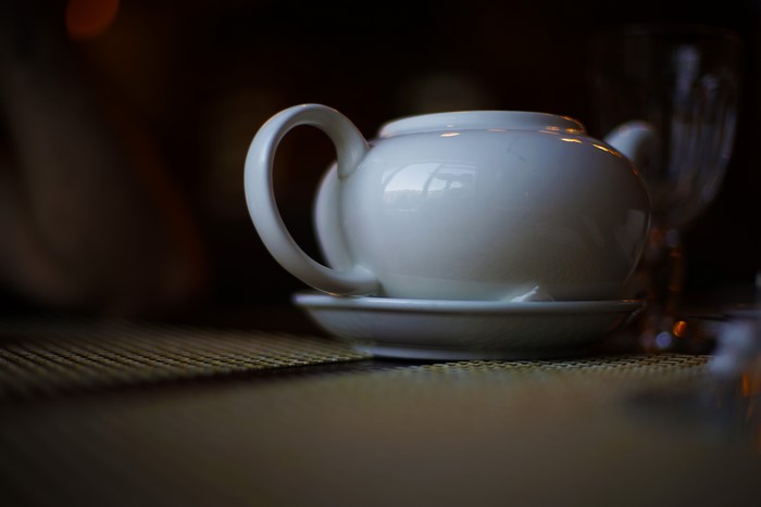 White teapot on a saucer
