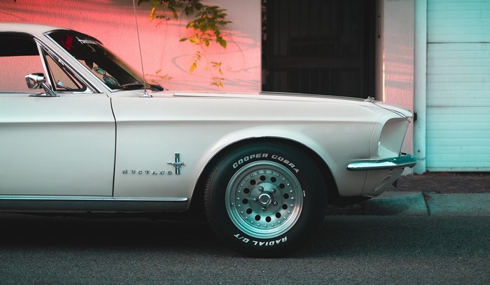 White Ford Mustang parked outdoors