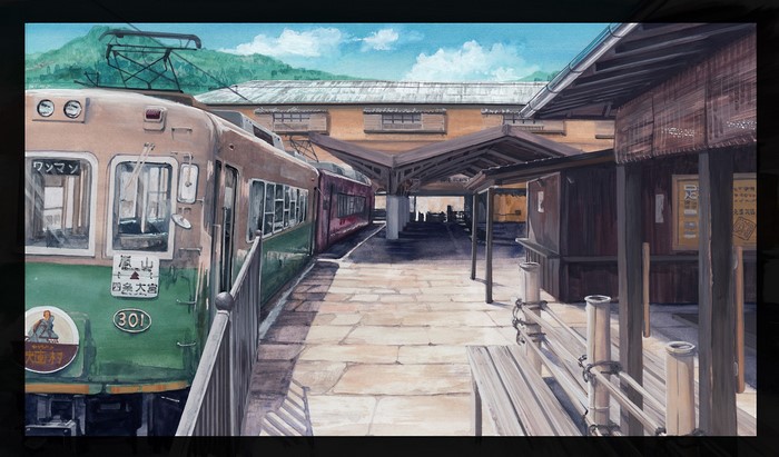 Train station with a train and mountains