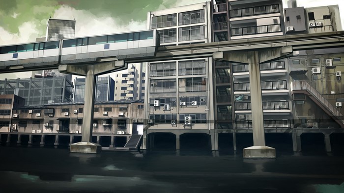 Monorail train over a canal in a dense urban cityscape