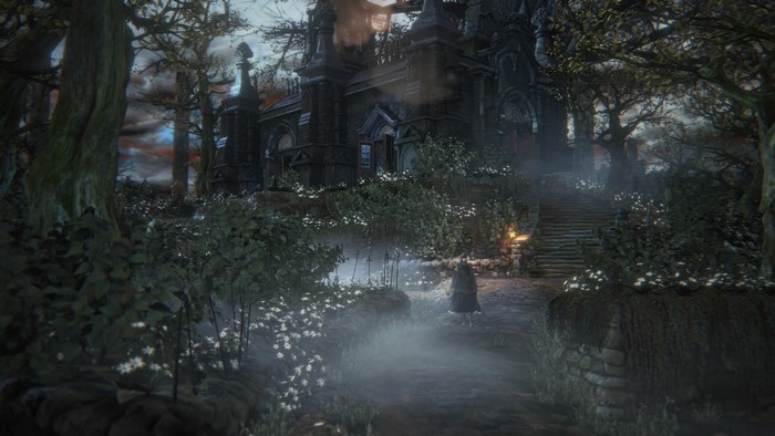 Bloodborne screenshot of a dark gothic building and forest