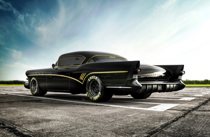 Black custom Buick with gold trim on a runway
