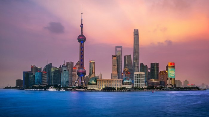 Shanghai cityscape with Oriental Pearl Tower at sunset