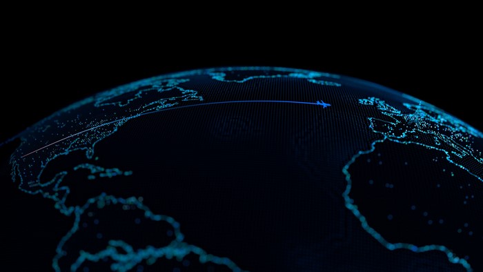 Digital globe with airplane flight path