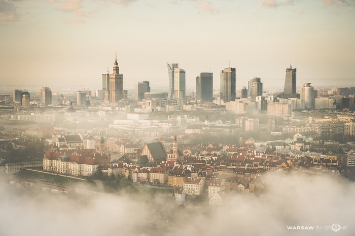 Warsaw skyline shrouded in mist with old town in foreground