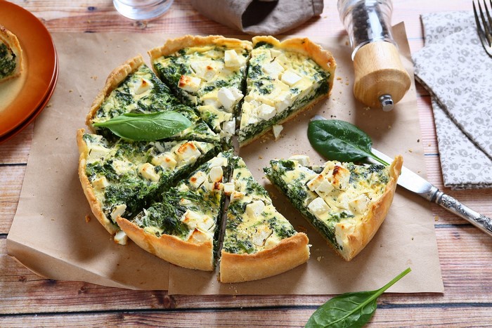 Spinach and Feta Quiche on a Wooden Table