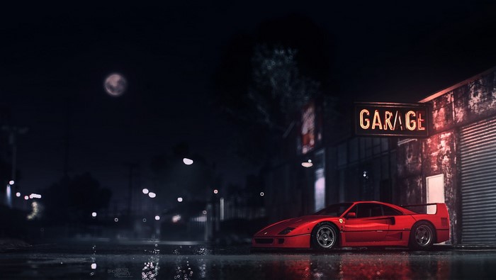 Red Ferrari F40 parked outside a garage at night