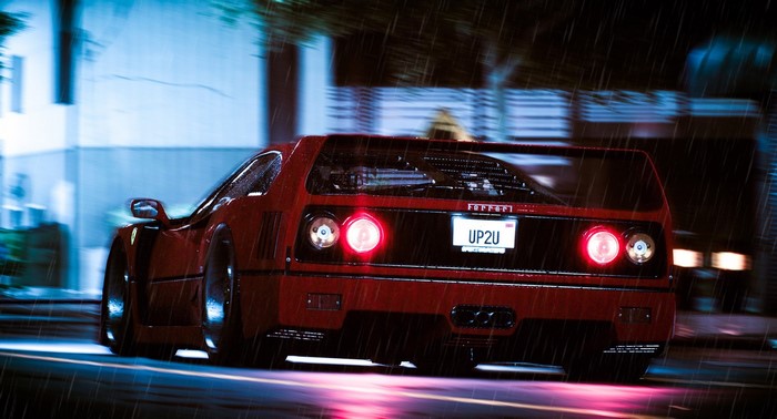 Red Ferrari F40 driving in the rain at night