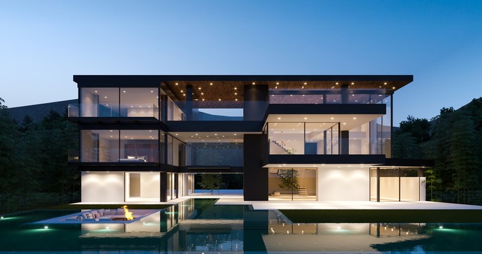 Modern mansion with swimming pool at dusk