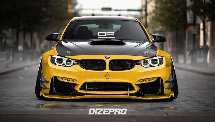 Yellow BMW M4 with carbon fiber hood on street