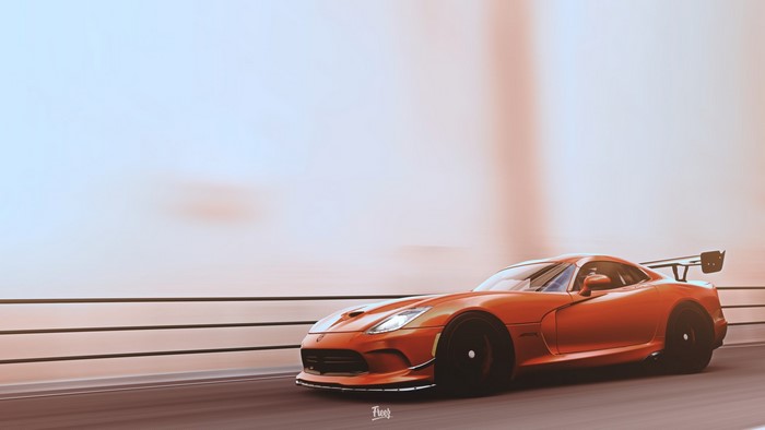 Orange Dodge Viper ACR driving on a road