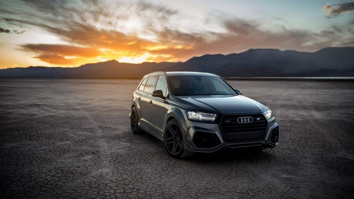 Audi RS Q7 ABT SUV on cracked earth at sunset
