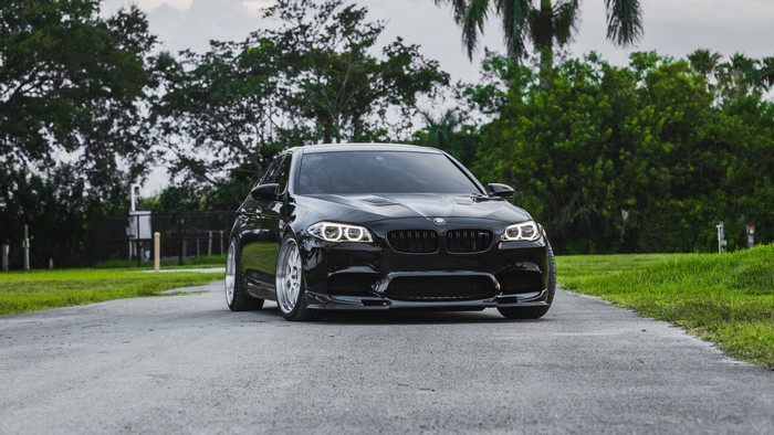 Black BMW F10 M5 Sedan on Road