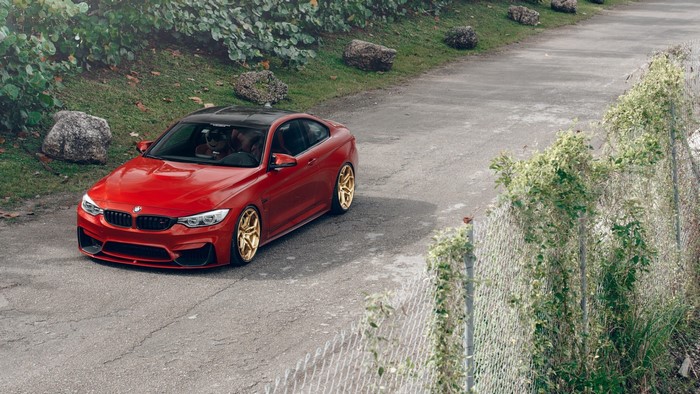 Red BMW M4 Coupe with Gold Wheels