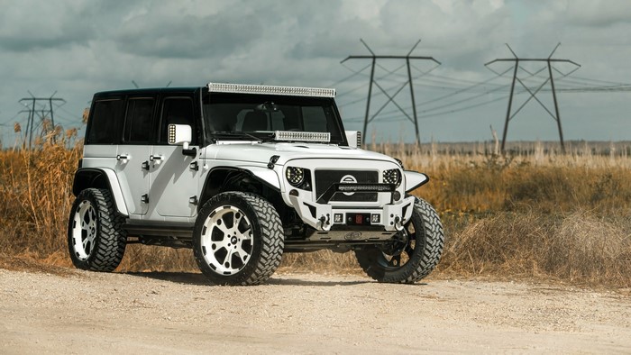 White Jeep Wrangler with custom modifications