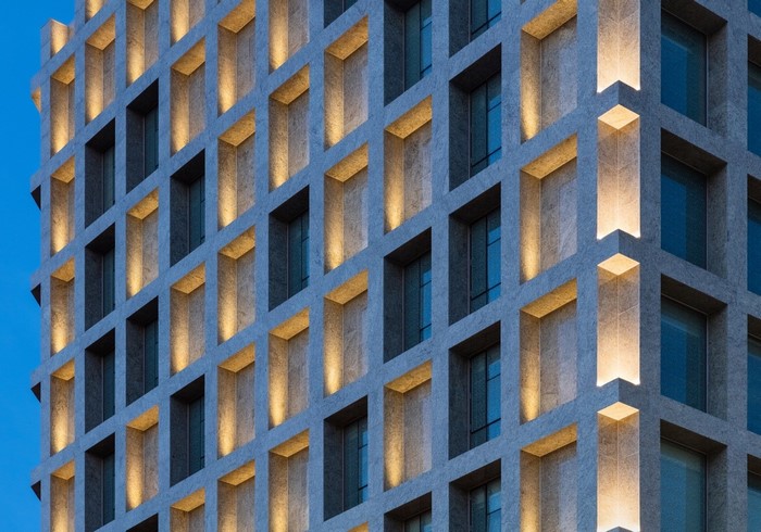 Modern building facade with illuminated windows
