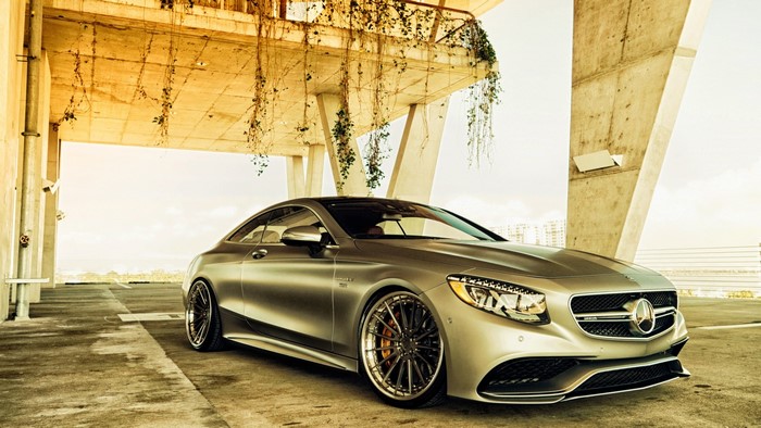Silver Mercedes-Benz S-Class Coupe parked under a concrete structure