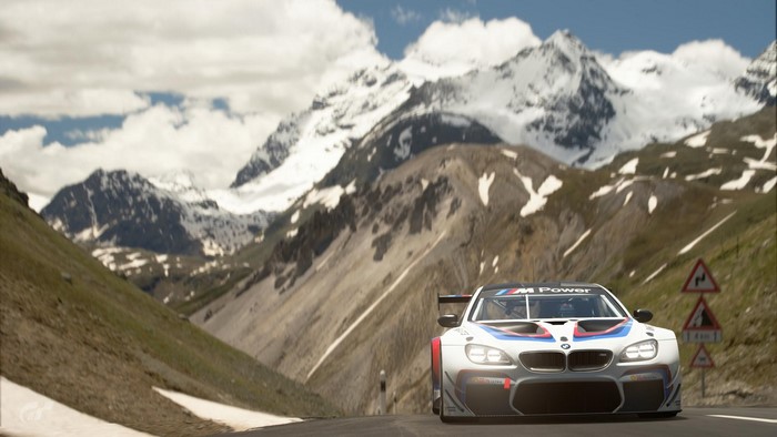 BMW M Power race car on mountain road